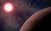 地球から130光年離れた赤色矮星(左)を回る三つの惑星の想像図=NASA提供・共同
