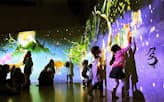 チームラボが昨年末に沖縄の百貨店で開催した「未来の遊園地」。壁に映る象形文字を触ると、物語が展開する