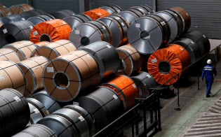 FILE PHOTO: A red-hot steel plate passes through a press at the ArcelorMittal steel plant in Ghent, Belgium, May 22, 2018. REUTERS/Yves Herman/File Photo FILE PHOTO: A red-hot steel plate passes through a press at the ArcelorMittal steel plant in Ghent, Belgium, May 22, 2018. REUTERS/Yves Herman/File Photo