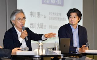 討論する中川恵一氏(左)と西川大輔氏（25日、東京・大手町）