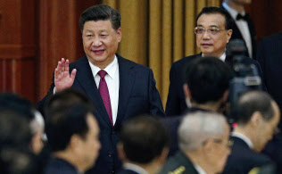 習近平国家主席は中国共産党の指導と企業統治の「融入」を訴える=AP 習近平国家主席は中国共産党の指導と企業統治の「融入」を訴える=AP