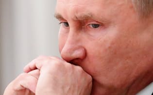 プーチン大統領の工作に欧米は身構える（10月23日、モスクワ）=ロイター