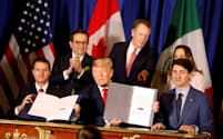 新NAFTA交渉で合意した3カ国首脳（2018年11月、ブエノスアイレス）=ロイター