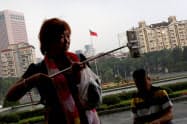 台湾を訪れた中国人観光客=ロイター 台湾を訪れた中国人観光客=ロイター