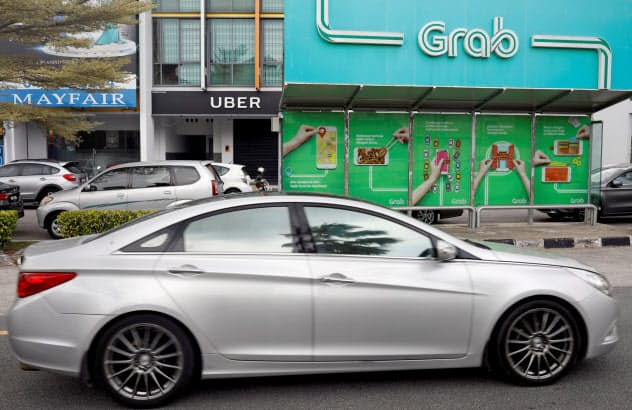 グラブはマレーシア配車市場で圧倒的な存在感=ロイター グラブはマレーシア配車市場で圧倒的な存在感=ロイター