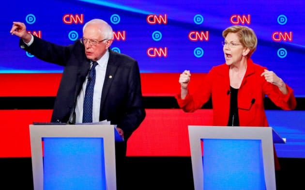米民主党の大統領候補のサンダース氏(左)とウォーレン氏は移民受け入れと大きな政府の両立を目指している=ロイター
米民主党の大統領候補のサンダース氏(左)とウォーレン氏は移民受け入れと大きな政府の両立を目指している=ロイター