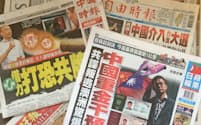 オーストラリアで政治亡命を希望している中国側のスパイとされる人物の選挙介入問題を伝える24日付台湾各紙の見出しは真っ二つに割れた