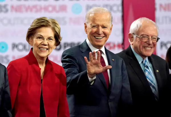 バイデン前副大統領(中)をサンダース上院議員(右)やウォーレン上院議員ら左派系候補が追う=ロイター