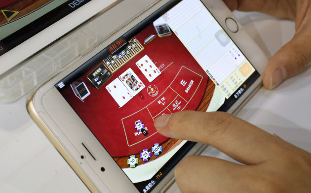 新型肺炎の感染が拡大するなか、中国ではゲームアプリのダウンロード数が急増した=ロイター 新型肺炎の感染が拡大するなか、中国ではゲームアプリのダウンロード数が急増した=ロイター