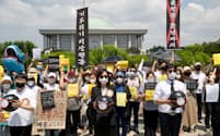 韓国で環境問題への対策強化を求めるデモ参加者=ゲッティ共同