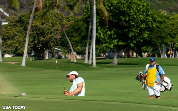 January 17, 2021; Honolulu, Hawaii, USA; Aaron Baddeley hits his bunker shot on the 18th hole during the final round of the Sony Open golf tournament at Waialae Country Club. Mandatory Credit: Kyle Terada-USA TODAY Sports