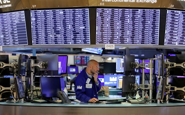 A trader works on the trading floor at the New York Stock Exchange (NYSE) in Manhattan, New York City, U.S., August 9, 2021. REUTERS/Andrew Kelly