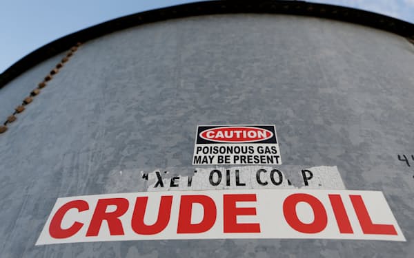 FILE PHOTO: A sticker reads crude oil on the side of a storage tank in the Permian Basin in Mentone, Loving County, Texas, U.S. November 22, 2019. REUTERS/Angus Mordant/File Photo