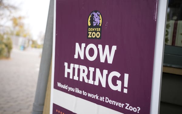 A sign stands at the entrance to encourage job applicants, Tuesday, Nov. 2, 2021, at the Denver Zoo in east Denver. (AP Photo/David Zalubowski)