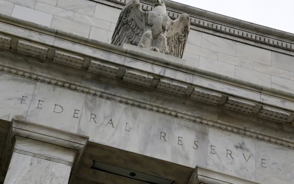 An eagle tops the U.S. Federal Reserve building's facade in Washington, July 31, 2013. The U.S. Federal Reserve likely will decide at the end of a policy meeting on Wednesday to continue buying bonds at an $85 billion monthly pace, but it could alter an accompanying statement to spell out the possibility of scaling back purchases later this year. REUTERS/Jonathan Ernst    (UNITED STATES - Tags: POLITICS BUSINESS) - GM1E97V1QA701