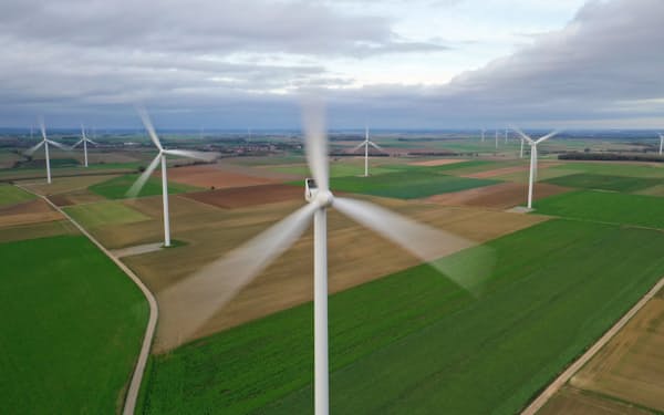 FILE PHOTO: An aerial view shows power-generating windmill turbines in a wind farm in Morchies, France, November 8, 2020. Picture taken with a drone REUTERS/Pascal Rossignol/File Photo
