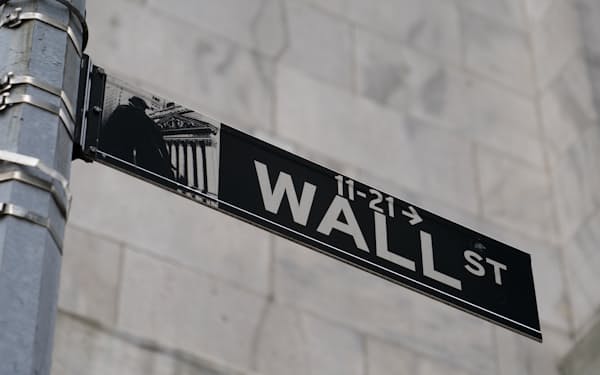 A Wall Street sign is shown in the Financial District, Wednesday, Oct. 13, 2021, in the Manhattan borough of New York. Stocks are opening modestly higher on Wall Street Thursday, Nov. 4, potentially setting the market up to set more record highs.   (AP Photo/John Minchillo, File)