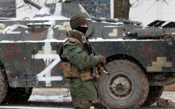 A service member of pro-Russian troops in a uniform without insignia stands on a street of the separatist-controlled village of Anadol during Ukraine-Russia conflict in the Donetsk region, Ukraine March 10, 2022. REUTERS/Alexander Ermochenko