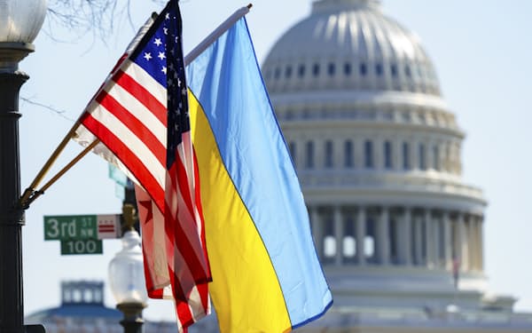 The flags of Ukraine, the United States, and the District of Columbia fly together on Pennsylvania Avenue near the Capitol, Saturday, March 5, 2022, by order of the mayor of Washington. (AP Photo/J. Scott Applewhite)