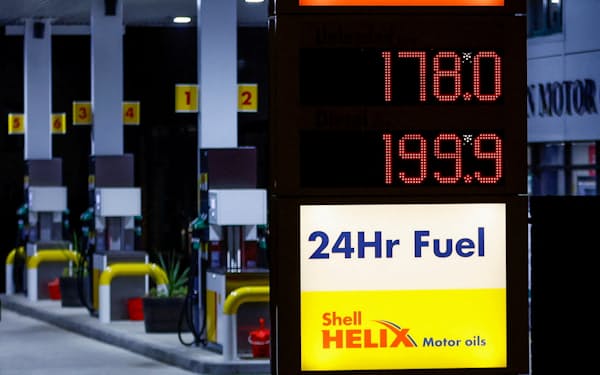 Increased fuel prices are displayed at a filling station as Russia's invasion of Ukraine continues, in Long Stratton, Britain, March 10, 2022. REUTERS/Andrew Boyers
