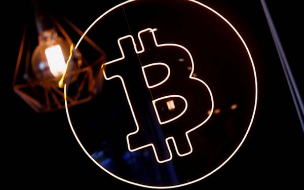 A neon logo of cryptocurrency Bitcoin is seen at the Crypstation cafe, in downtown Buenos Aires, Argentina May 5, 2022. Picture taken May 5, 2022. REUTERS/Agustin Marcarian