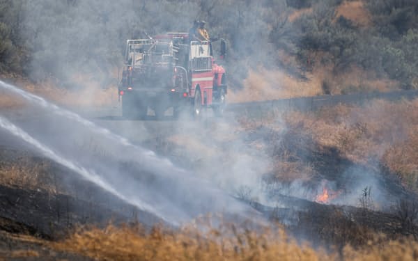 米国各地では近年、気候変動による山火事の被害が多発している＝ロイター