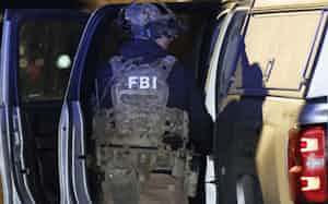 A member of the FBI returns equipment to their vehicle at a storage facility where the Brown University shooter, identified by authorities as Claudio Neves Valente, took his own life, in Salem, New Hampshire, U.S., December 18, 2025. REUTERS/CJ Gunther A member of the FBI returns equipment to their vehicle at a storage facility where the Brown University shooter, identified by authorities as Claudio Neves Valente, took his own life, in Salem, New Hampshire, U.S., December 18, 2025. REUTERS/CJ Gunther