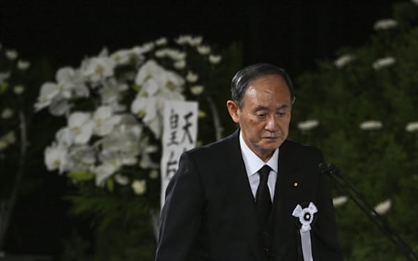 Former Japanese Prime Minister Yoshihide Suga attends the state funeral of former Prime Minister Shinzo Abe at the Nippon Budokan in Tokyo Tuesday, Sept. 27, 2022. (Philip Fong/Pool Photo via AP)