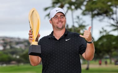 Jan 18, 2026; Honolulu, Hawaii, USA; Chris Gotterup holds the championship trophy after winning the Sony Open in Hawaii. Mandatory Credit: Marco Garcia-Imagn Images