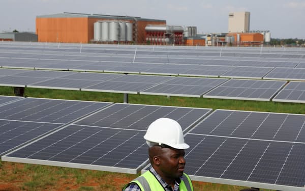 A visitor is seen at the new solar power plant of the South African arm of Heineken, the largest freestanding solar plant powering a brewery in South Africa, at the company's Sedibeng, Midvaal brewery in Johannesburg, South Africa, October 26, 2022. REUTERS/Siphiwe Sibeko