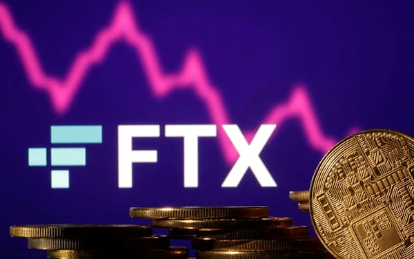 FILE PHOTO: FILE PHOTO: Representations of cryptocurrencies are seen in front of displayed FTX logo and decreasing stock graph in this illustration taken November 10, 2022. REUTERS/Dado Ruvic/Illustration/File Photo/File Photo