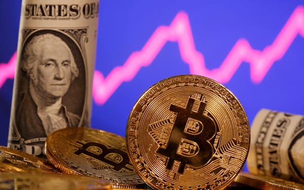 FILE PHOTO: FILE PHOTO: A representation of virtual currency bitcoin and a U.S. one dollar banknote are seen in front of a stock graph in this illustration taken January 8, 2021. REUTERS/Dado Ruvic/File Photo/File Photo