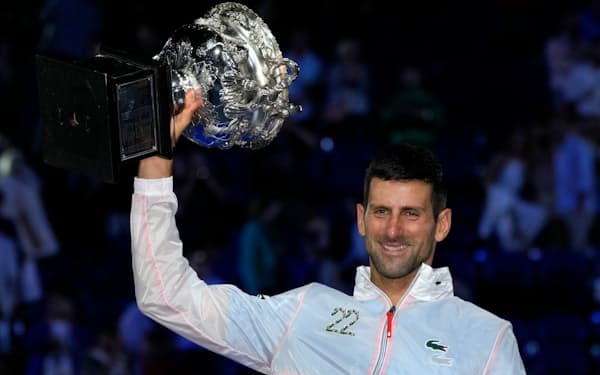 Novak Djokovic of Serbia holds the Norman Brookes Challenge Cup aloft after defeating Stefanos Tsitsipas of Greece in the men's singles final at the Australian Open tennis championship in Melbourne, Australia, Sunday, Jan. 29, 2023. (AP Photo/Aaron Favila)