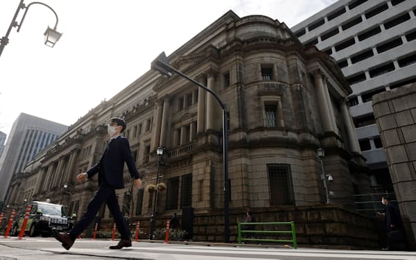 A man walks in front of the headquarters of Bank of Japan in Tokyo, Japan, January 18, 2023.   REUTERS/Issei Kato