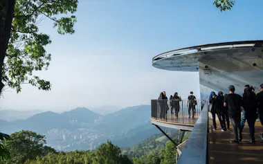 Visitors take in a sweeping vista from a viewing platform on Penang Hill, one of the Malaysian island's most popular tourist destinations. (All photos by Kit Yeng Chan)