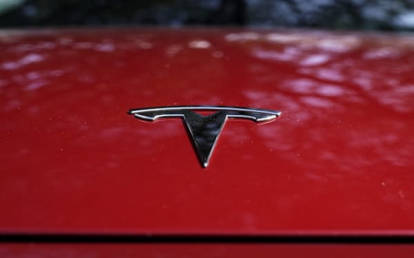 FILE - A Tesla logo is seen on a vehicle on display in Austin, Texas, Wednesday, Feb. 22, 2023. On Wednesday, March 1, Tesla executives said the company will use innovative manufacturing techniques and smaller factories to cut the cost of its next generation of vehicles by as much as half of the ones it now builds. (AP Photo/Eric Gay, File)