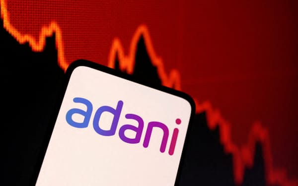 FILE PHOTO: Adani logo and decreasing stock graph is seen in this illustration taken January 31, 2023. REUTERS/Dado Ruvic/Illustration/File Photo
