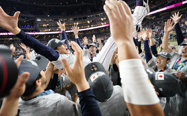 Japan manager Hideki Kuriyama (89) celebrates with players after defeating the United States in the World Baseball Classic championship game, Tuesday, March 21, 2023, in Miami. (AP Photo/Wilfredo Lee)