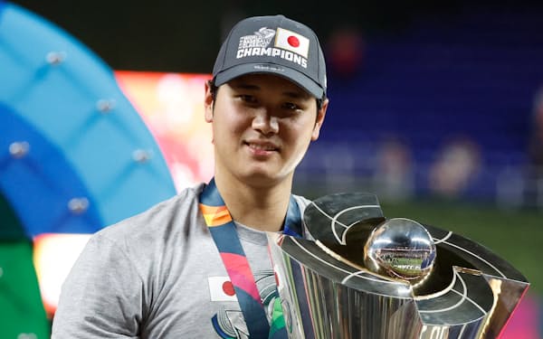 Mar 21, 2023; Miami, Florida, USA;  Japan designated hitter and closing pitcher Shohei Ohtani (16) stands with the World Baseball Classic trophy trophy after defeating the USA in the World Baseball Classic at LoanDepot Park. Mandatory Credit: Rhona Wise-USA TODAY Sports