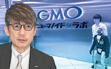 GMOの熊谷正寿会長兼社長㊧と同社のヒト型ロボット研究拠点