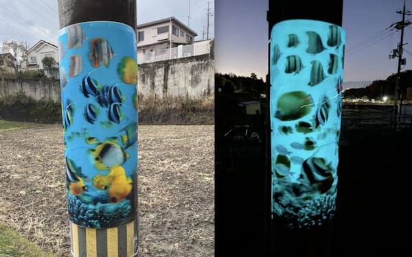 実証実験では電柱に貼った魚の泳ぐフィルムの蓄光素材が夜㊨だと光ることを確かめた（大阪府枚方市）