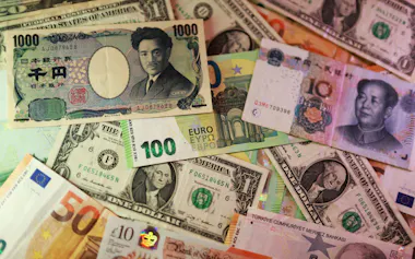 FILE PHOTO: U.S. dollar, Euro, Yen, Pound, Turkish Lira, Yuan banknotes are seen in this illustration taken March 24, 2026. REUTERS/Dado Ruvic/Illustration/File Photo