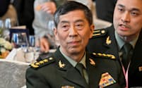 李尚福氏は中央軍事委員会委員や国務委員のポストも外された（6月、シンガポール）＝ロイター
