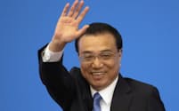 FILE - Then Chinese Premier Li Keqiang waves during a press conference after the closing session of the National People's Congress in Beijing's Great Hall of the People on March 15, 2019. Former Premier Li Keqiang, China's top economic official for a decade, died Friday, Oct. 27, 2023 of a heart attack. He was 68. (AP Photo/Ng Han Guan, File)