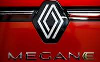 A Renault Megane E-Tech logo is seen on a Renault Megane E-Tech electric car on display at a showroom of a car dealer in Reze near Nantes, France, November 13, 2023. REUTERS/Stephane Mahe