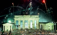 Fireworks explode over the Brandenburg Gate in Berlin as tens of.thousands gather to celebrate the reunification of the two Germanys in.this October 3, 1990 file picture. Today Germany celebrates the 13th.anniversary of German reunification in Magdeburg, the capital of the.German state of Saxony-Anhalt. REUTERS/Wolfgang Rattay/File Photo.REUTERS..MAD