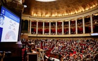 仏下院は移民法案を可決した（19日、パリ）＝ロイター
