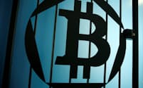 FILE PHOTO: A bitcoin logo is pictured on a door in an illustration picture taken at La Maison du Bitcoin in Paris May 27, 2015. REUTERS/Benoit Tessier/File Photo