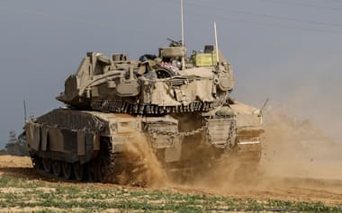 An Israeli armoured personnel carrier (APC) re-enters Israel from Gaza, amid the ongoing conflict between Israel and the Palestinian Islamist group Hamas, near the Israel-Gaza border, in southern Israel, January 11, 2024. REUTERS/Tyrone Siu