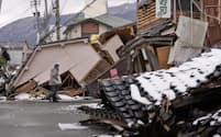 能登半島地震では家屋倒壊が相次いだ＝共同